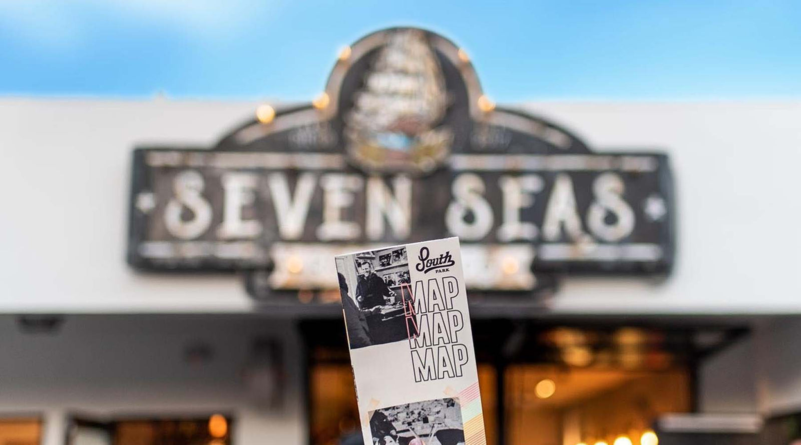 seven seas roasting south park location with map brochure of South Park San Diego in the foreground. 