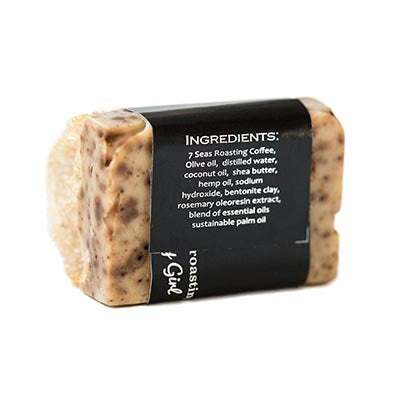Back of Bar of coffee soap infused with a loofah and seven seas logo in collaboration with early girl creations and ingredient list