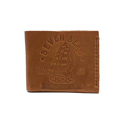 Brown leather wallet with seven seas logo branded on front of wallet